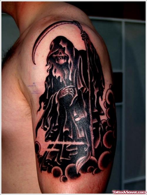 Beautiful Black Ink Grim Reaper Tattoo On Man Left Half Sleeve