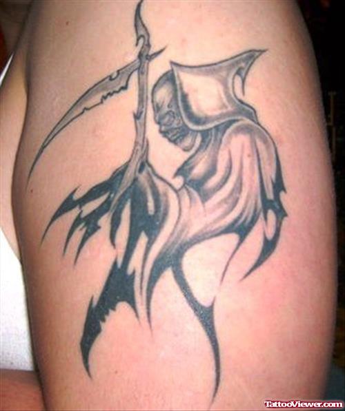 Amazing Tribal Grim Reaper Tattoo
