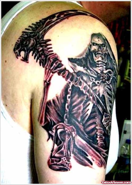 Black Ink Grim Reaper Tattoo On Man Right Sleeve