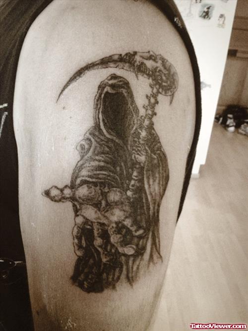 Grey Ink Grim Reaper Tattoo On Bicep