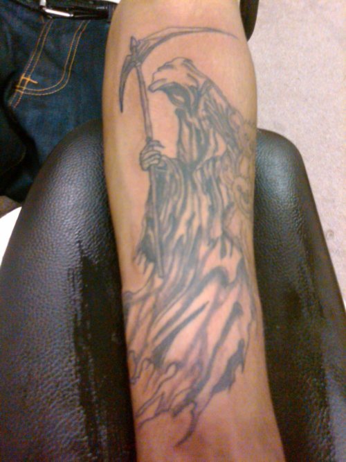 Grey Ink Grim Reaper Tattoo On Left Arm
