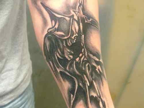 Dark Ink Grim Reaper Tattoo On Left Arm