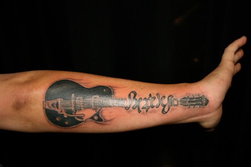 Guitar Tattoo On Man Left Forearm