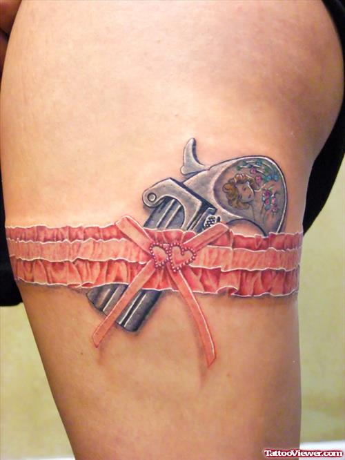 Small Gun Garter And Lace Tattoo
