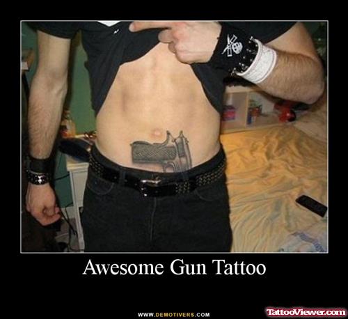 Grey Ink gun Tattoo On stomach
