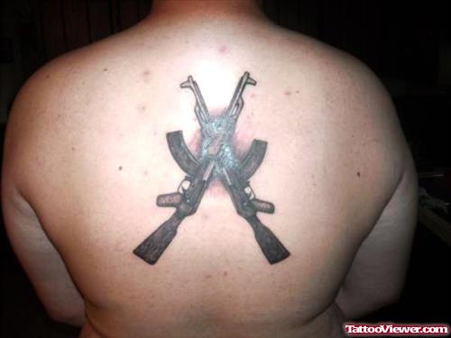 Black Ink Gun Tattoos On Back Body