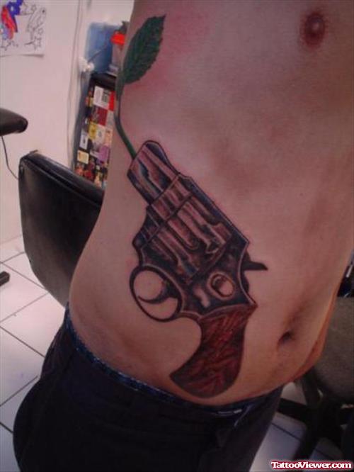 Man Rib Side Gun Tattoo For Men