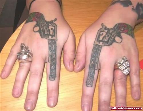 Large Gun Tattoos On Both Hands