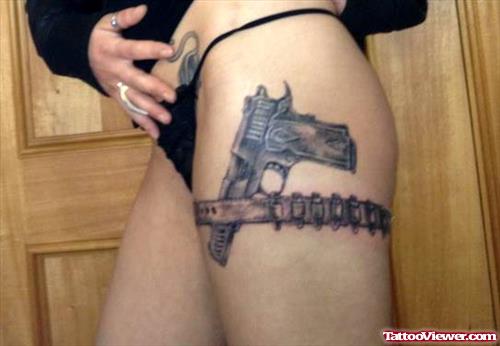 Gun Tattoo On Girl Left Thigh
