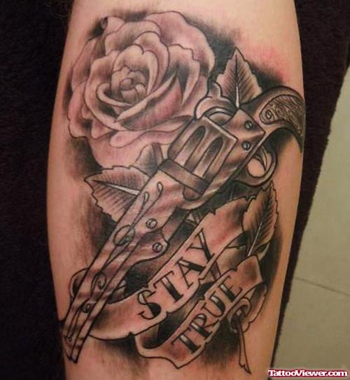 Grey Ink Rose Flower And Gun Tattoo