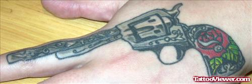 Colored Gun Tattoo On Left Hand