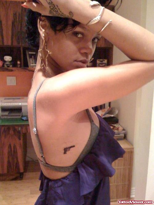 Rihanna Gun Tattoo On Rib Side