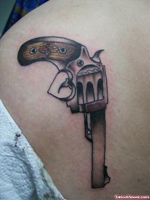 Nice Grey Ink Gun Tattoo On Hip