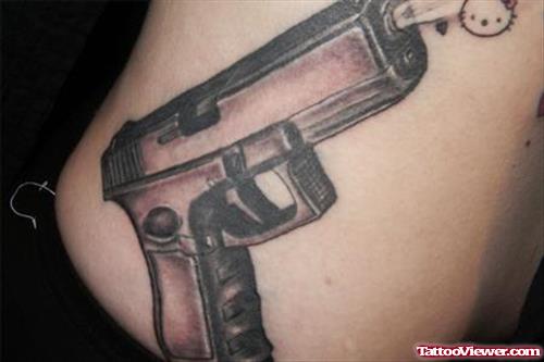 Grey Ink Gun Tattoo On Side