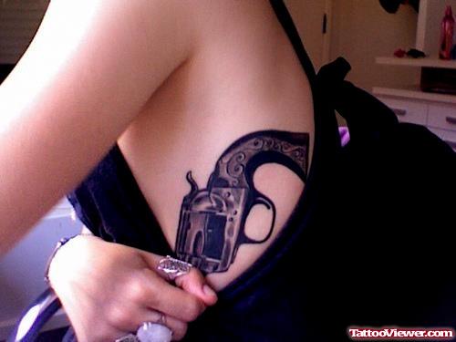 Black Ink Gun Tattoo On Side