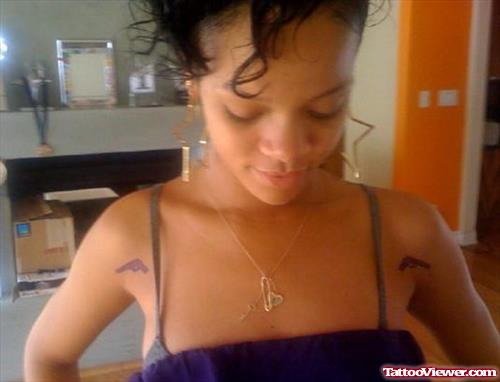 Rihanna With Gun Tattoos On Both Shoulders