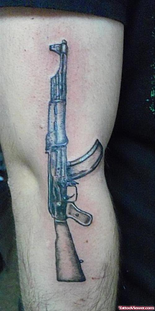 Gun Tattoo On Right Arm