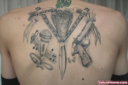 Gun Tattoo On Man Upperback