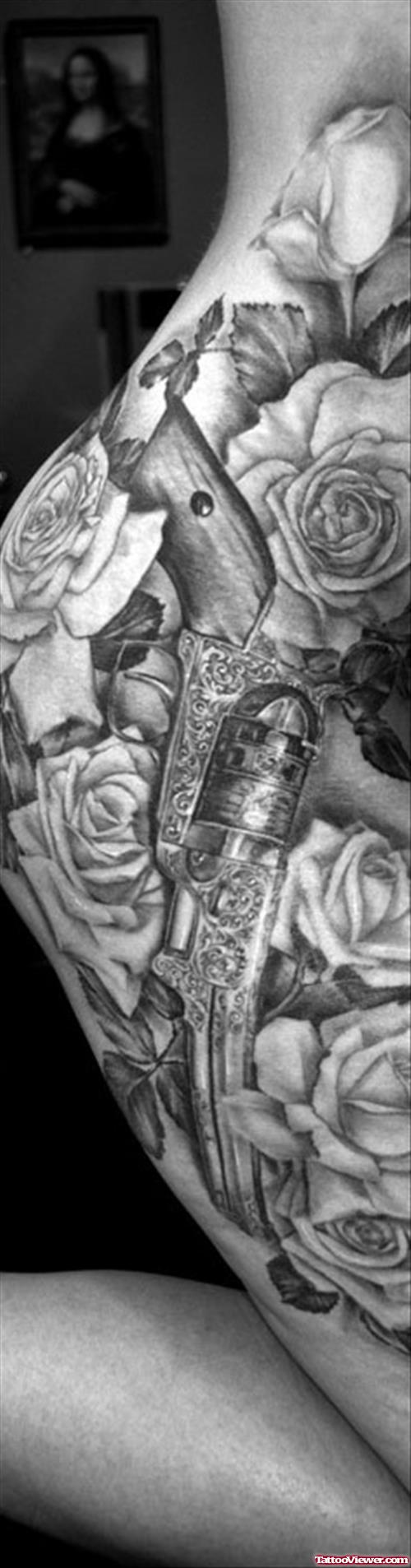 Grey Ink Rose Flowers And Gun Tattoo On Rib Side