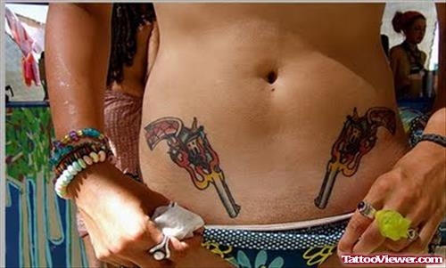 Color Gun Tattoos On Both Hips