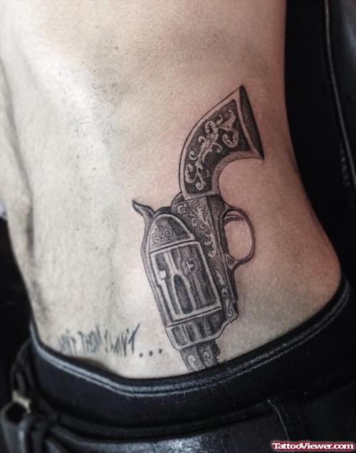 Best Grey Ink Gun Tattoo On Lowerback