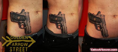 Gun Tattoo On Man Hip