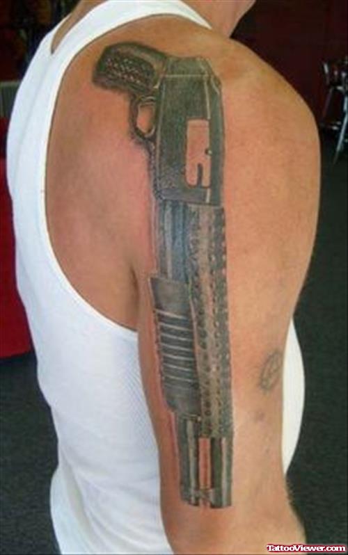 Grey Ink Gun Tattoo On Man Right Half Sleeve