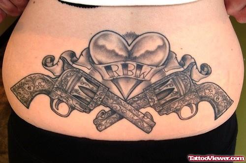 Awesome Grey Ink Heart And Gun Tattoos On Lowerback