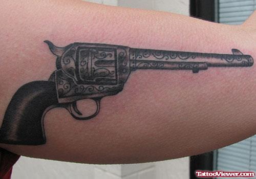 Awesome Grey Ink Gun Tattoo On Muscles