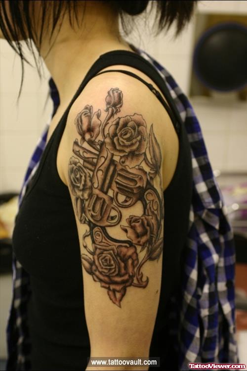 Rose And Gun Tattoo On Left Half Sleeve