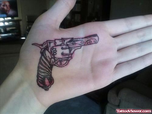 Gun Tattoo On Left Palm