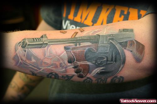 Gun Tattoo On Left Arm