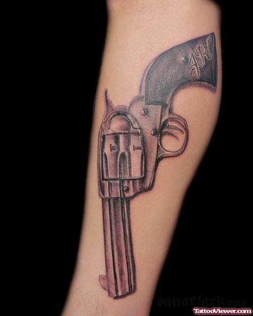 Grey Ink Gun Tattoo On Right Arm