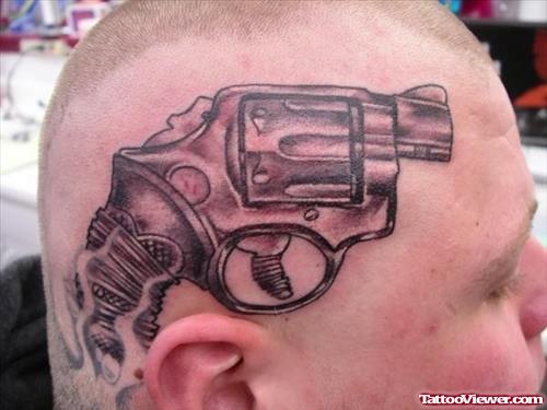 Grey Ink Gun Tattoo On Man Head