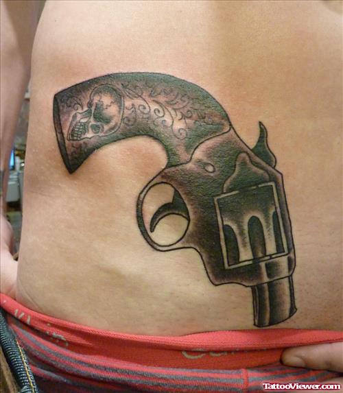 Black Ink Gun Tattoo On Right Hip