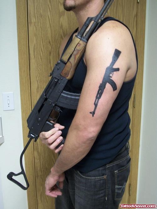 Amazing Man Left Half Sleeve Gun Tattoo