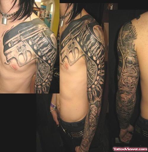 Grey Ink Gun Tattoo On Left Sleeve
