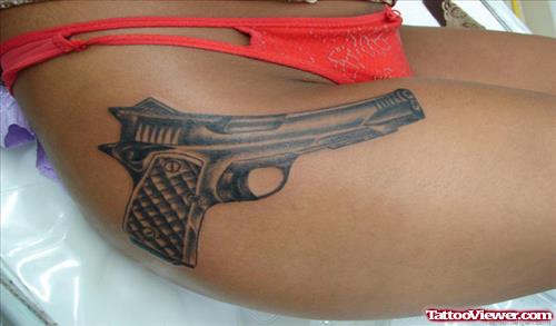 Grey Ink Gun Tattoo On Right Side For Girls