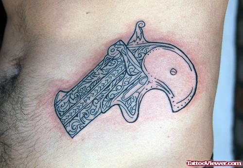 Grey Ink Gun Tattoo On Left Side