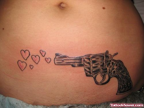 Shooting Hearts Gun Tattoo On Hip
