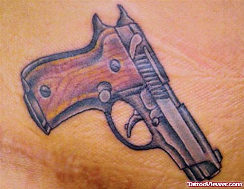 Color Ink Gun Tattoo