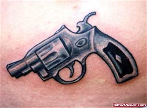 Attractive Grey Ink Small Gun Tattoo