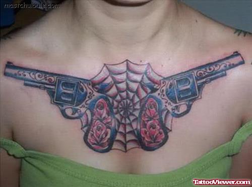 Spider Web And Gun Tattoos On Chest