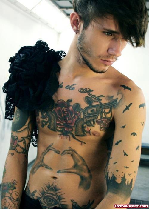 Red Rose Flower And Guns Tattoos On Man Chest