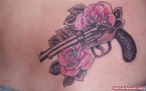 Pink Rose Flowers And Gun Tattoo