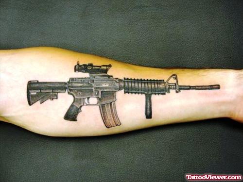 Grey Ink Super Gun Tattoo On Left Arm