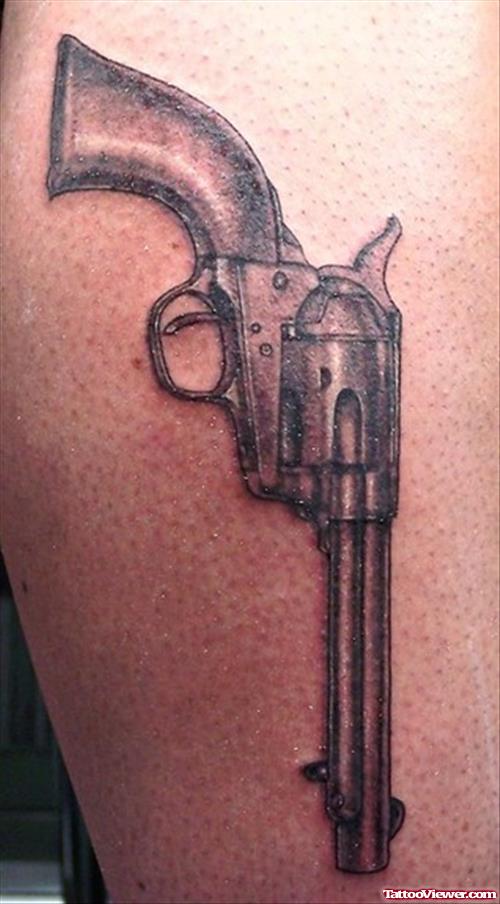 Grey Ink Gun Tattoo