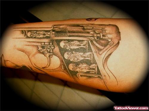 Beautiful Grey Ink Gun Tattoo