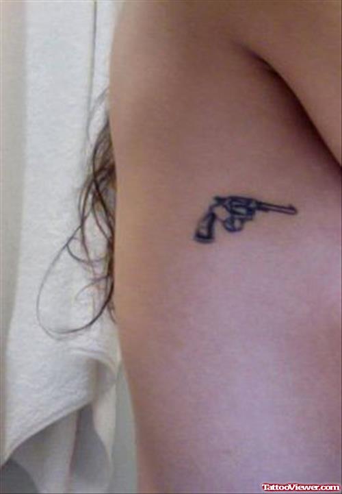 Side Rib Grey Ink Gun Tattoo On Rib Side