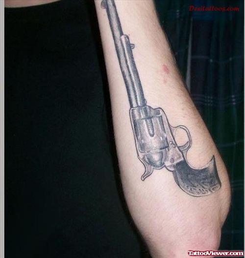 Gun Tattoo On Guy Left Arm